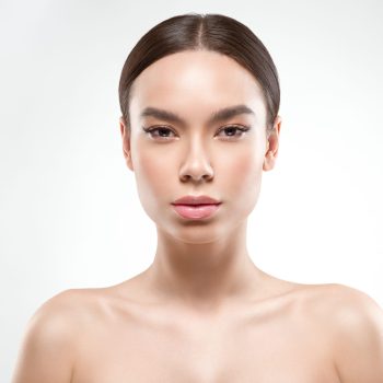 Beauty woman face portrait. Beautiful model girl perfect fresh clean skin color lips purple red.