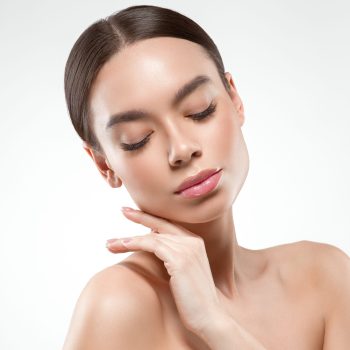 Beauty woman face portrait. Beautiful model girl perfect fresh clean skin color lips purple red.